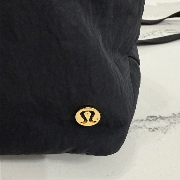 Lululemon Black Tote Crossbody Bag with gold accents.  Excellent condition. - Picture 10 of 11